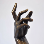 01534-2377744302-photograph of a hand of a bronze statue , sharp focus, highly detailed.png